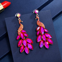 Súper aretes de cristal de diamantes de pavo real con temperamento