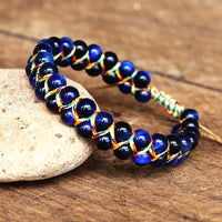 Bracelet Ajustable Oeil de Tigre tissé à la main