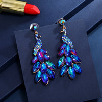Súper aretes de cristal de diamantes de pavo real con temperamento