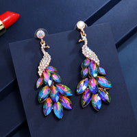 Súper aretes de cristal de diamantes de pavo real con temperamento
