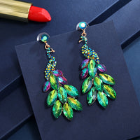 Súper aretes de cristal de diamantes de pavo real con temperamento