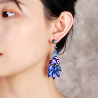 Súper aretes de cristal de diamantes de pavo real con temperamento