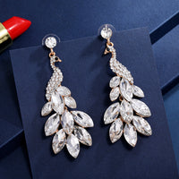 Súper aretes de cristal de diamantes de pavo real con temperamento