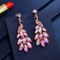 Súper aretes de cristal de diamantes de pavo real con temperamento