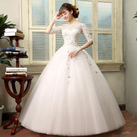 Vestido de novia con detalle de encaje y media manga