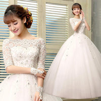 Vestido de novia con detalle de encaje y media manga