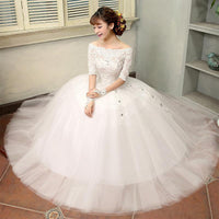Vestido de novia con detalle de encaje y media manga