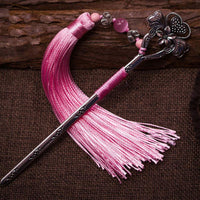 Marcapáginas de metal antiguo con borlas