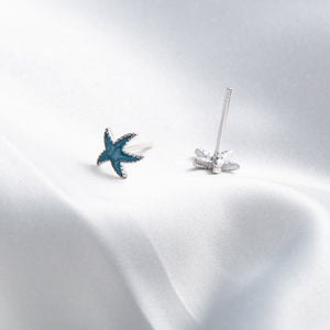 Pendientes de estrella de mar goteando