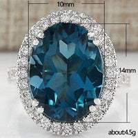 Elegante anillo de circonita azul pavo real con forma de huevo para mujer
