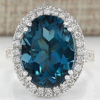 Elegante anillo de circonita azul pavo real con forma de huevo para mujer
