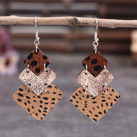 Boucles d'oreilles vintage en cuir à coutures léopard
