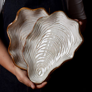 Platos en forma de concha de ostra
