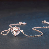 Bracelet coeur avec nœud cadeau en cristal rose
