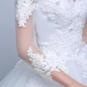 Robe de mariée jupe ample à manches en dentelle