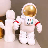 Muñecos de peluche de astronautas y cohetes
