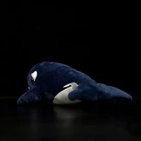 Jolie poupée de baleine noire noire
