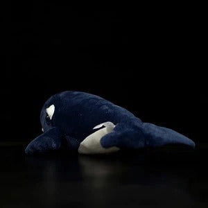 Jolie poupée de baleine noire noire